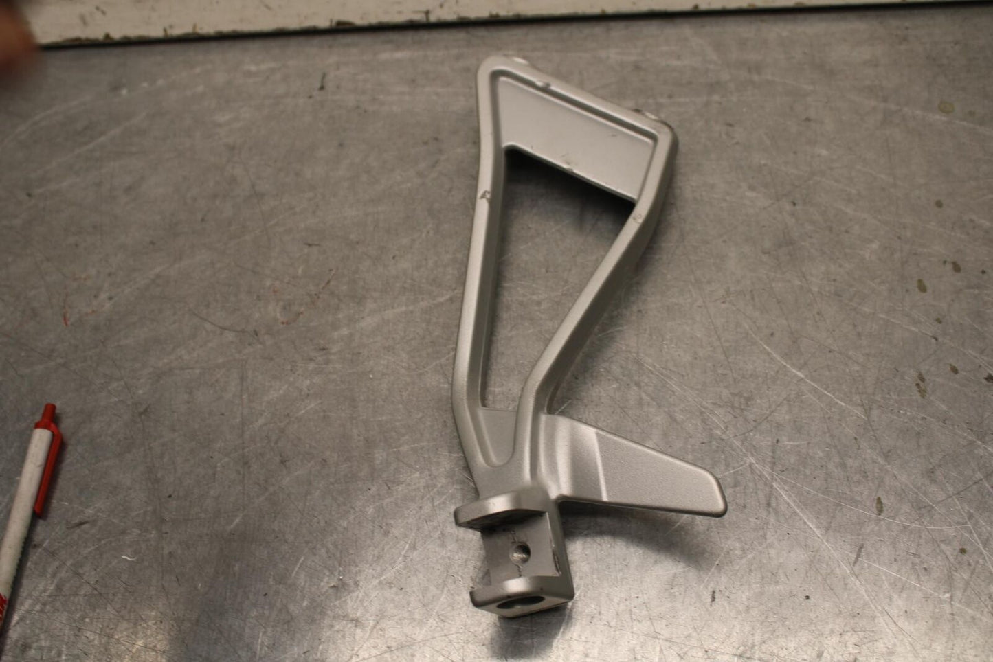 20-23 APRILIA RS660 LEFT PASSENGER FOOT PEG BRACKET MOUNT BB643