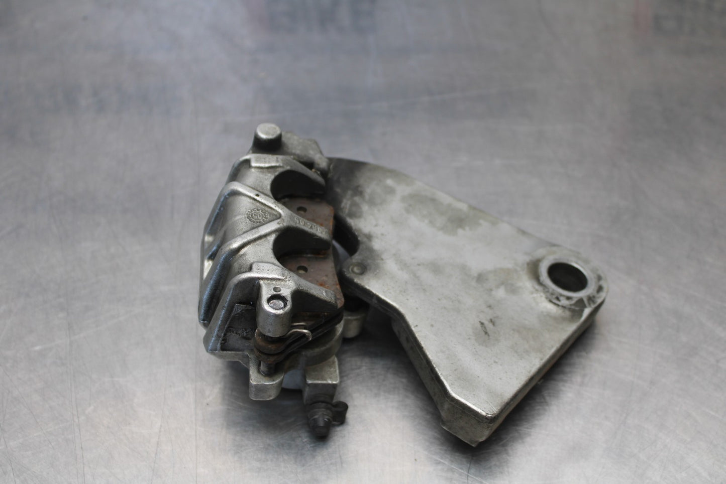 05-06 VICTORY KINGPIN DELUXE REAR BACK BRAKE CALIPER W MOUNT BRACKET BB195