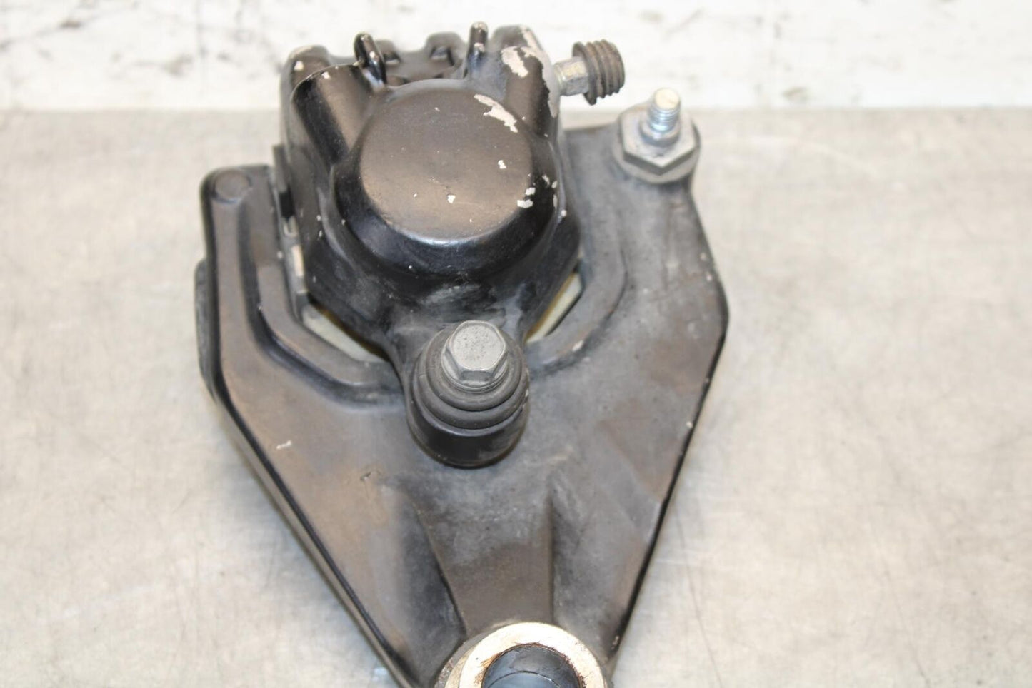 1977 Yamaha XS750 REAR BACK BRAKE CALIPER W MOUNT BRACKET BB554