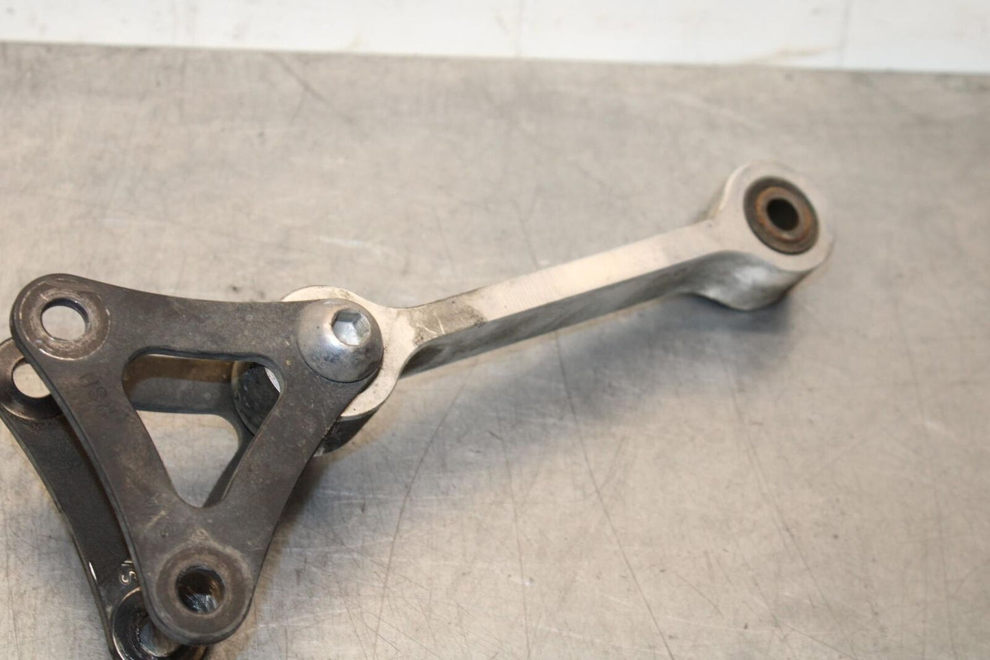 2012 Triumph Daytona 675R REAR DOGBONE SHOCK LINKAGE LINK BB589