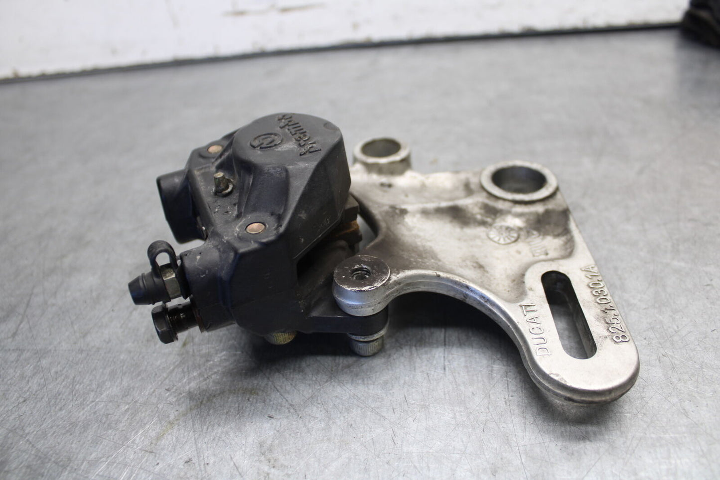 06-07 DUCATI MONSTER 695 REAR BACK BRAKE CALIPER W MOUNT BRACKET BB674