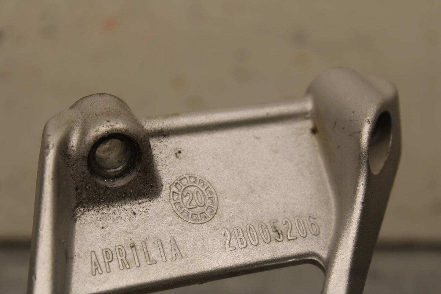 20-23 APRILIA RS660 LEFT PASSENGER FOOT PEG BRACKET MOUNT BB643