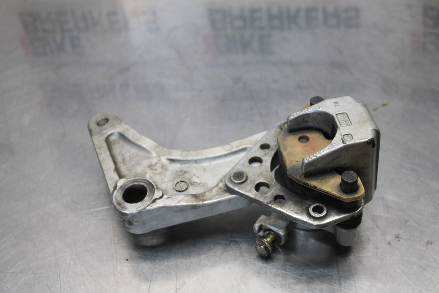 03-08 KAWASAKI VULCAN 1600 REAR BACK BRAKE CALIPER W MOUNT BRACKET BB196