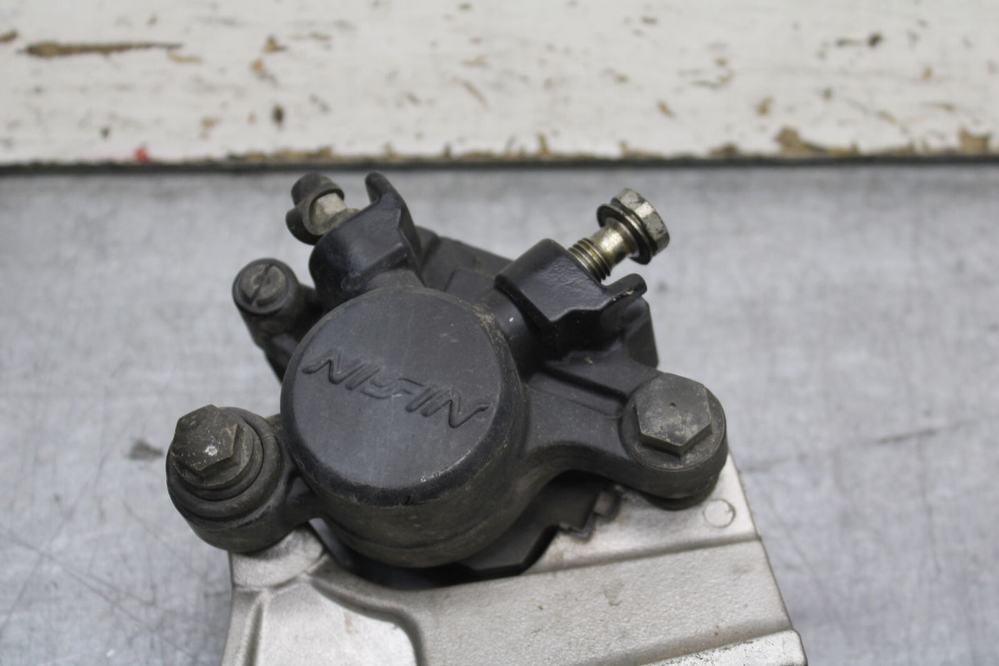 03-04 TRIUMPH DAYTONA 600 REAR BACK BRAKE CALIPER W MOUNT BRACKET BB745