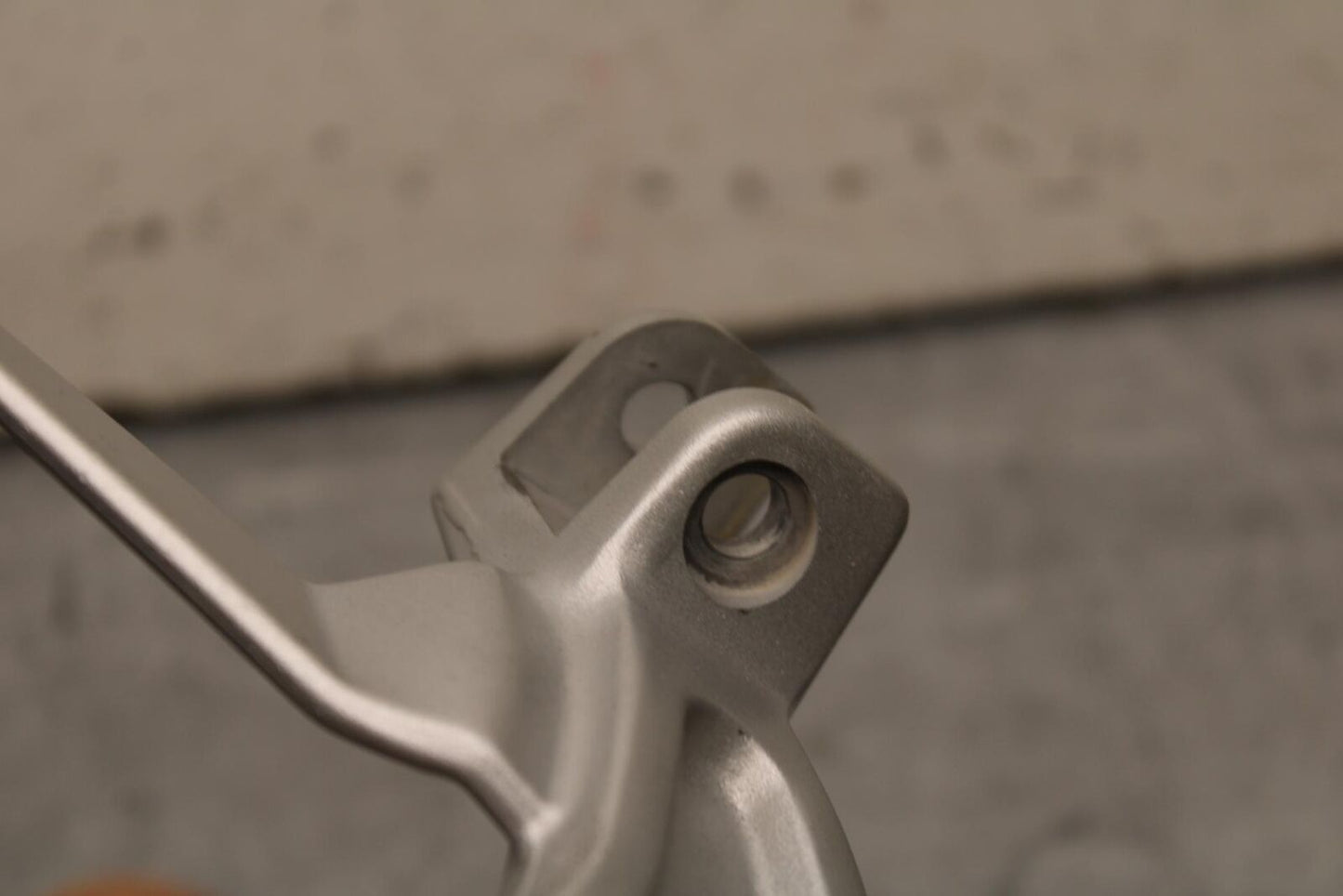 20-23 APRILIA RS660 LEFT PASSENGER FOOT PEG BRACKET MOUNT BB643