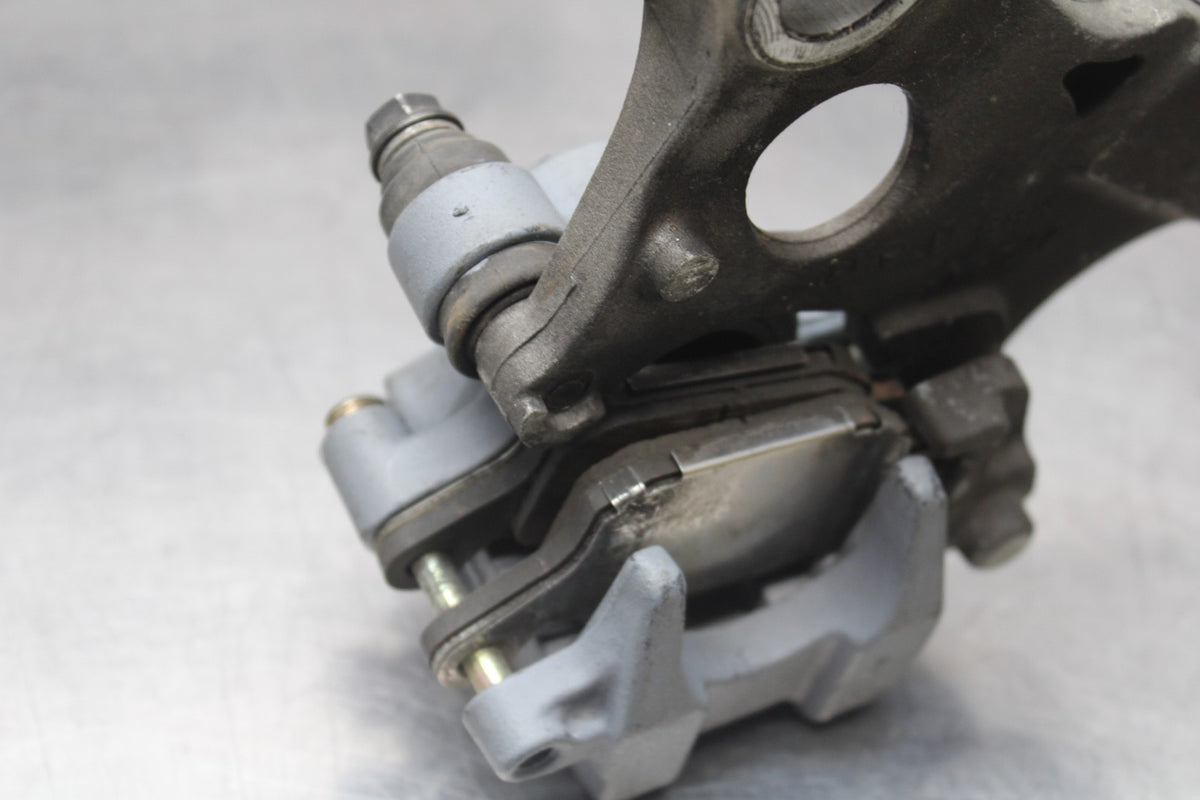 01-06 HONDA CBR600F4I REAR BACK BRAKE CALIPER W MOUNT BRACKET BB778