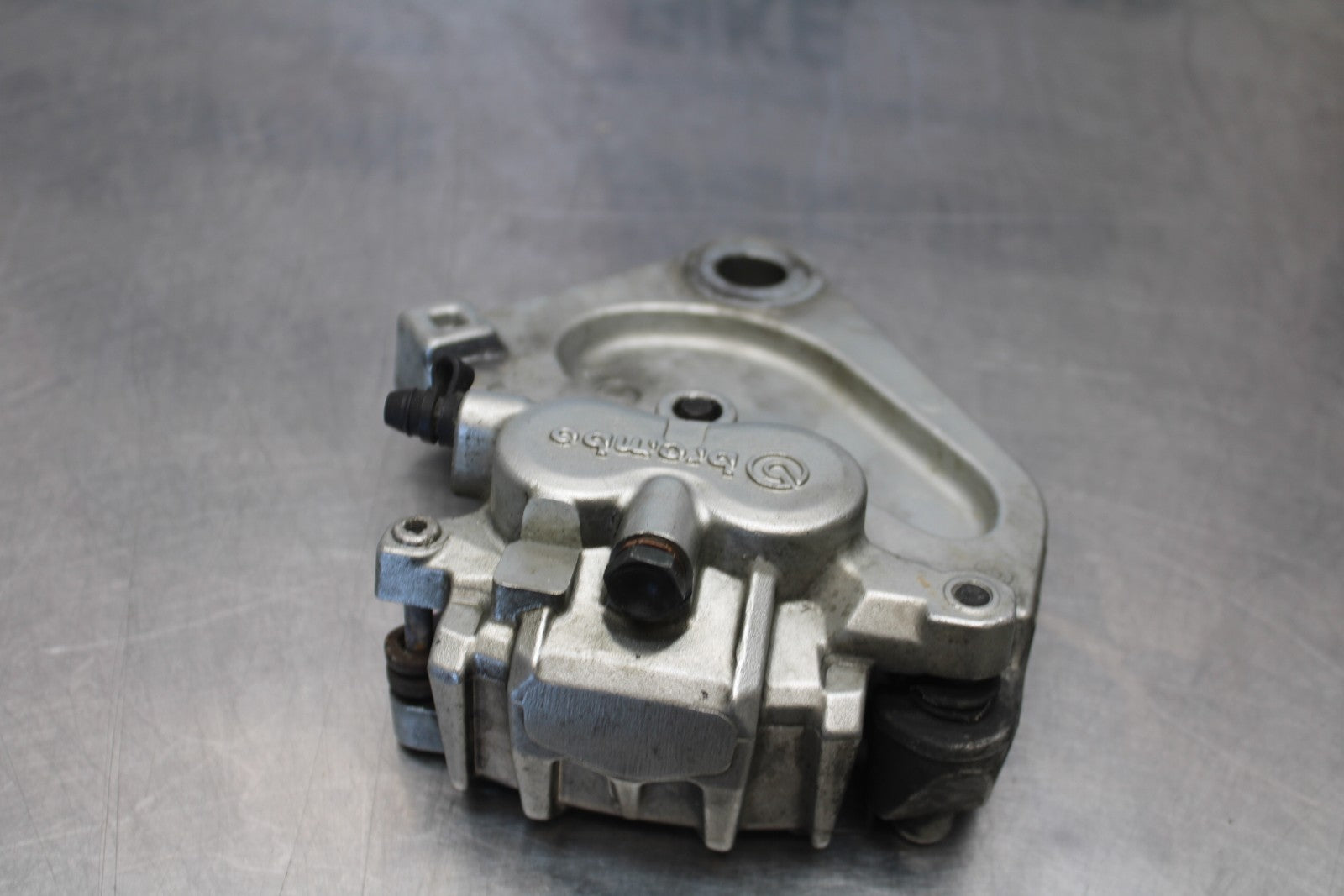 05-06 VICTORY KINGPIN DELUXE REAR BACK BRAKE CALIPER W MOUNT BRACKET BB195