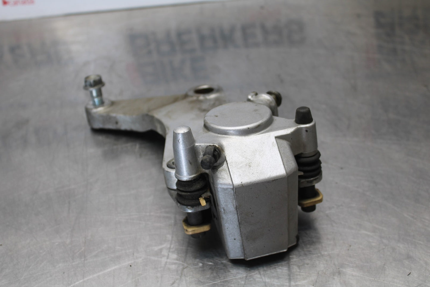 03-08 KAWASAKI VULCAN 1600 REAR BACK BRAKE CALIPER W MOUNT BRACKET BB196