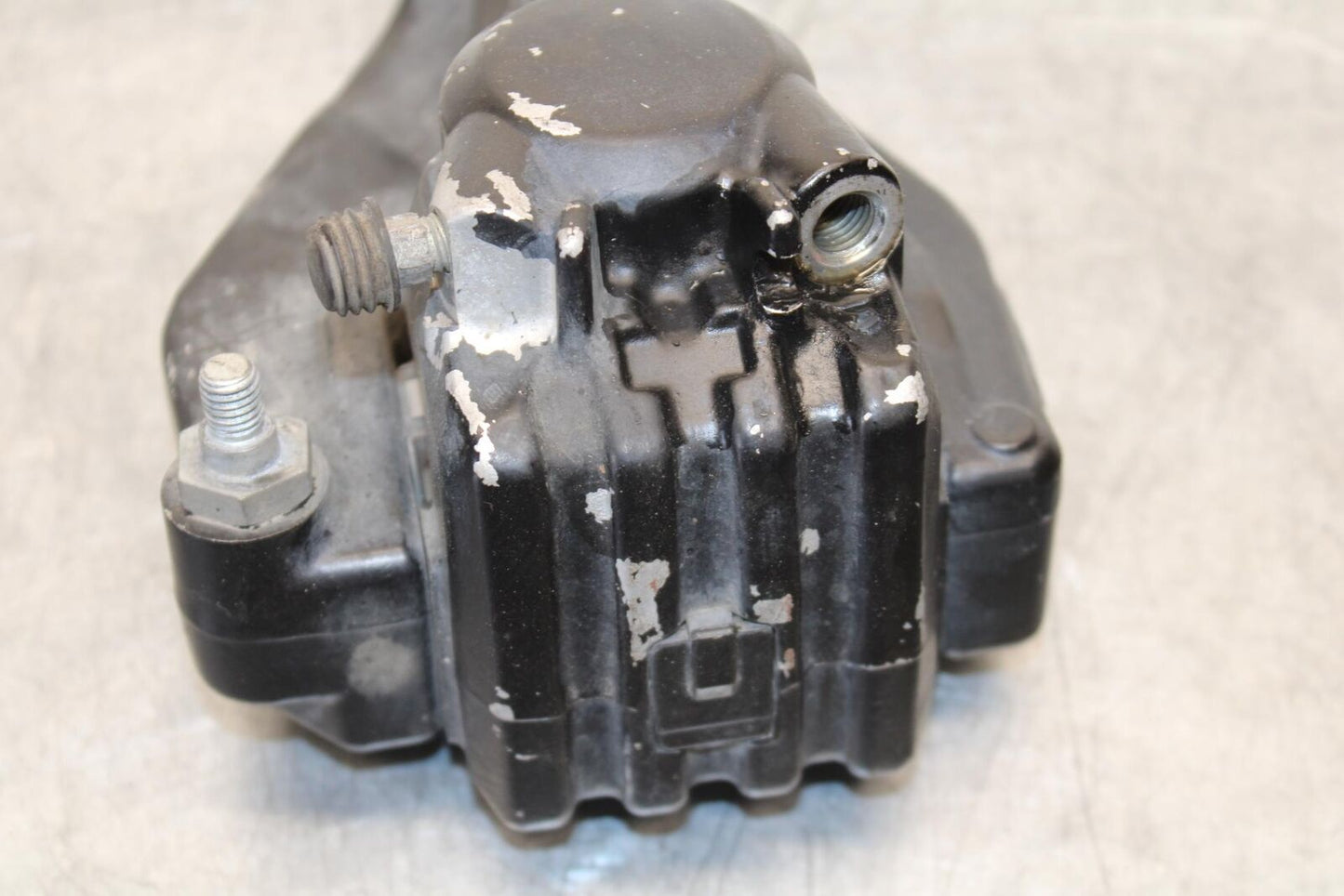 1977 Yamaha XS750 REAR BACK BRAKE CALIPER W MOUNT BRACKET BB554