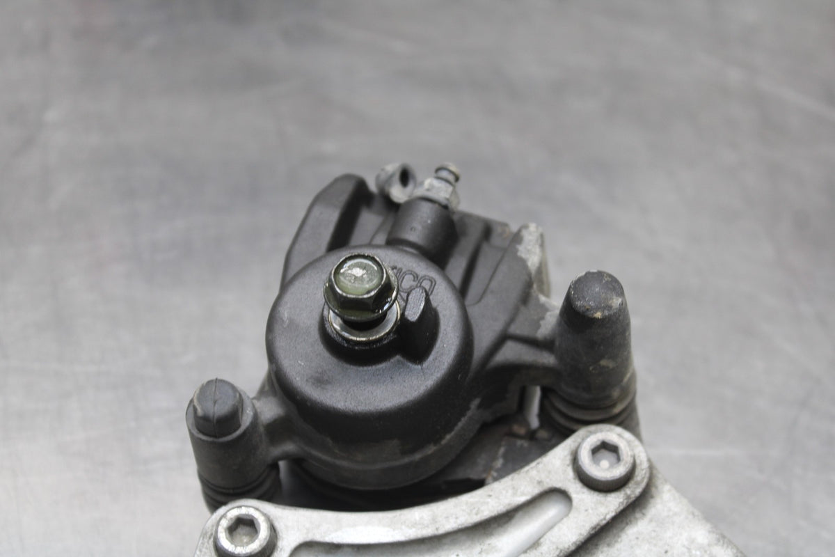06 KAWASAKI Z750 REAR BACK BRAKE CALIPER W MOUNT BRACKET BB837