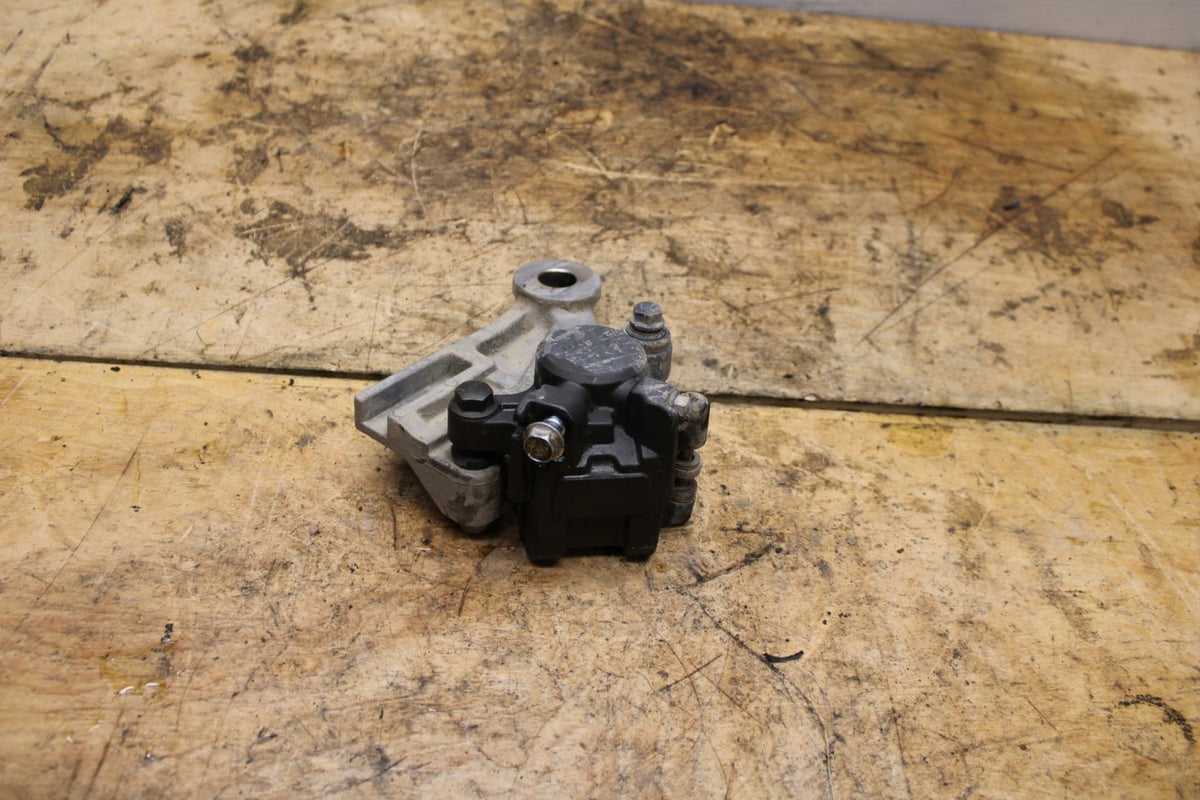 07-11 SUZUKI VSTROM 650 REAR BACK BRAKE CALIPER W MOUNT BRACKET