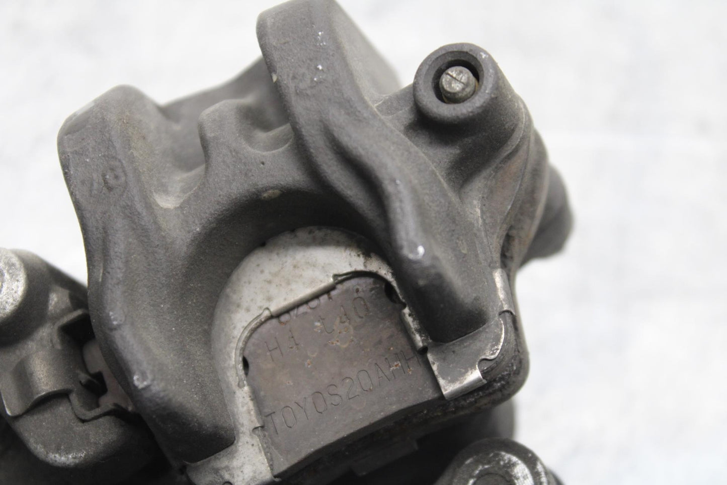 2007 Honda CBR600RR REAR BRAKE CALIPER W MOUNT BRACKET 43150-MFJ-D01 BB596