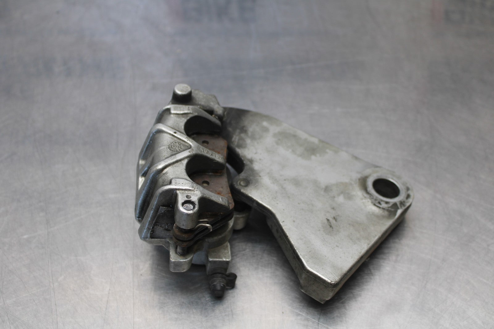 05-06 VICTORY KINGPIN DELUXE REAR BACK BRAKE CALIPER W MOUNT BRACKET BB195