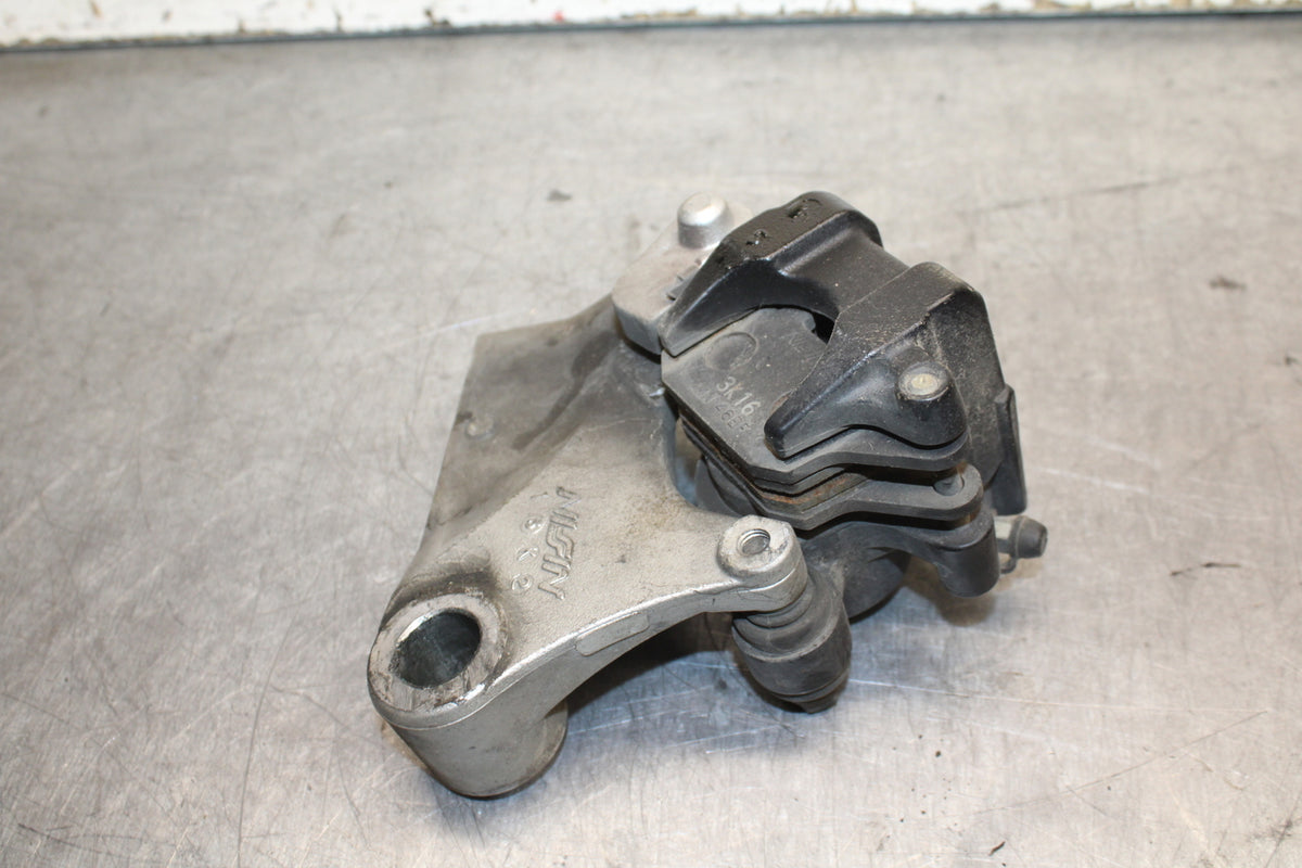 03-04 TRIUMPH DAYTONA 600 REAR BACK BRAKE CALIPER W MOUNT BRACKET BB745