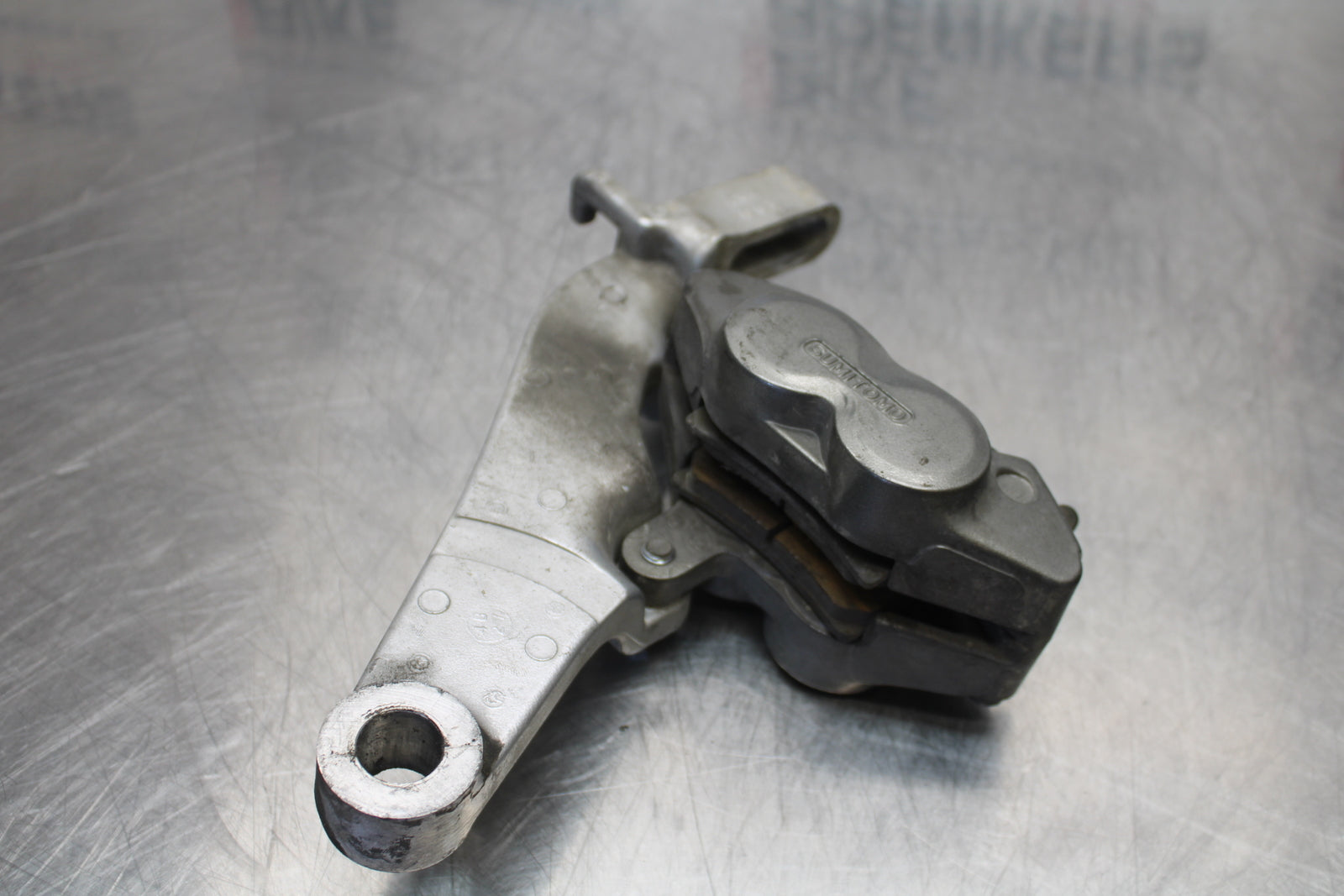 04 YAMAHA ROAD STAR XV1700A REAR BACK BRAKE CALIPER W MOUNT BRACKET BB155