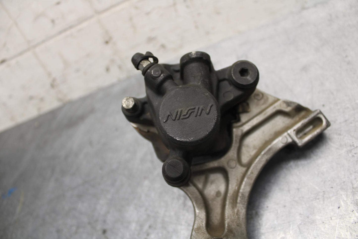 2007 Honda CBR600RR REAR BACK BRAKE CALIPER W MOUNT BRACKET 43150-MFJ-D01 BB42