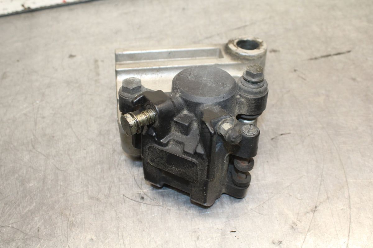 03-04 TRIUMPH DAYTONA 600 REAR BACK BRAKE CALIPER W MOUNT BRACKET BB745