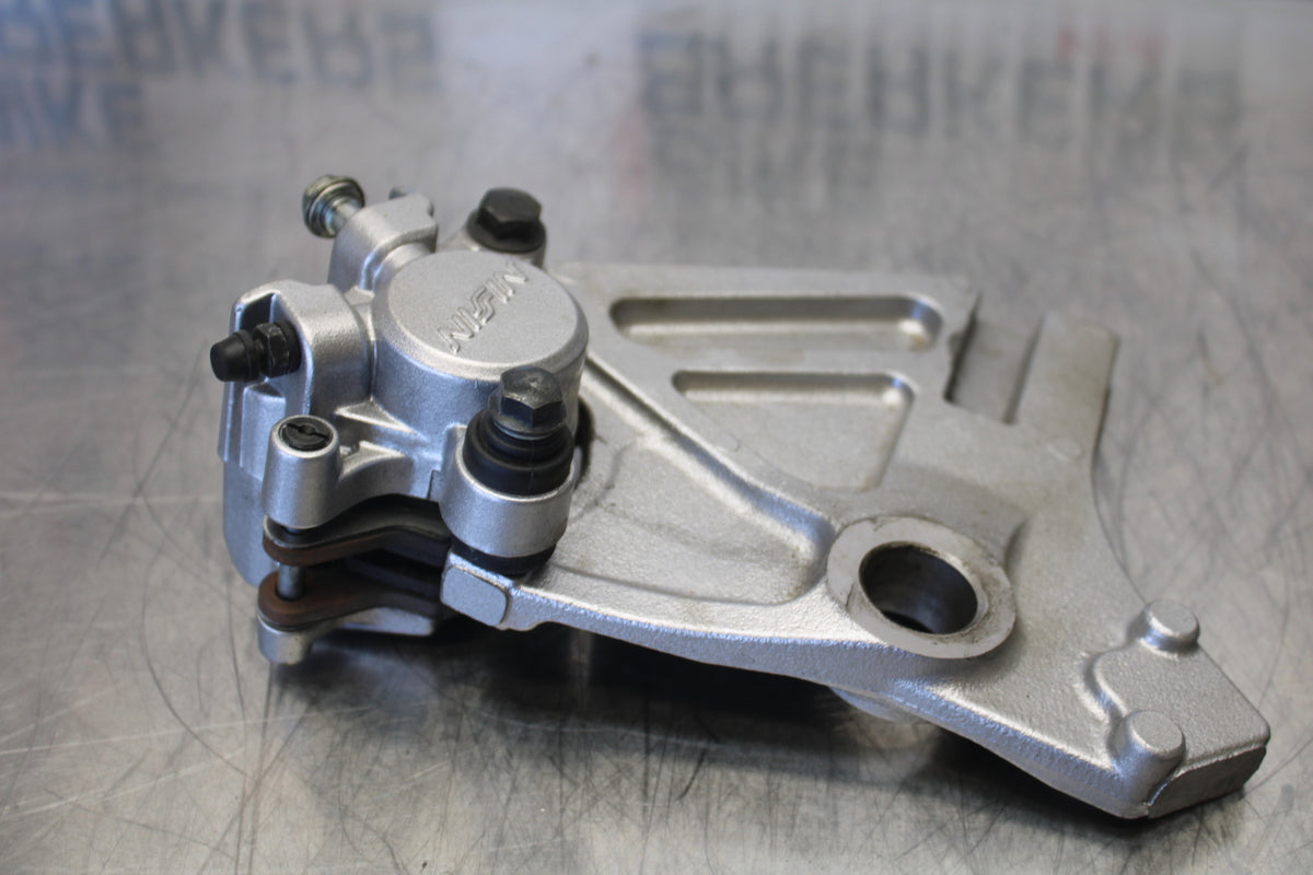 07 KAWASAKI Z1000 REAR BACK BRAKE CALIPER W MOUNT BRACKET BB148