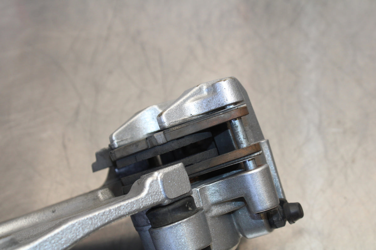 07 KAWASAKI Z1000 REAR BACK BRAKE CALIPER W MOUNT BRACKET BB148