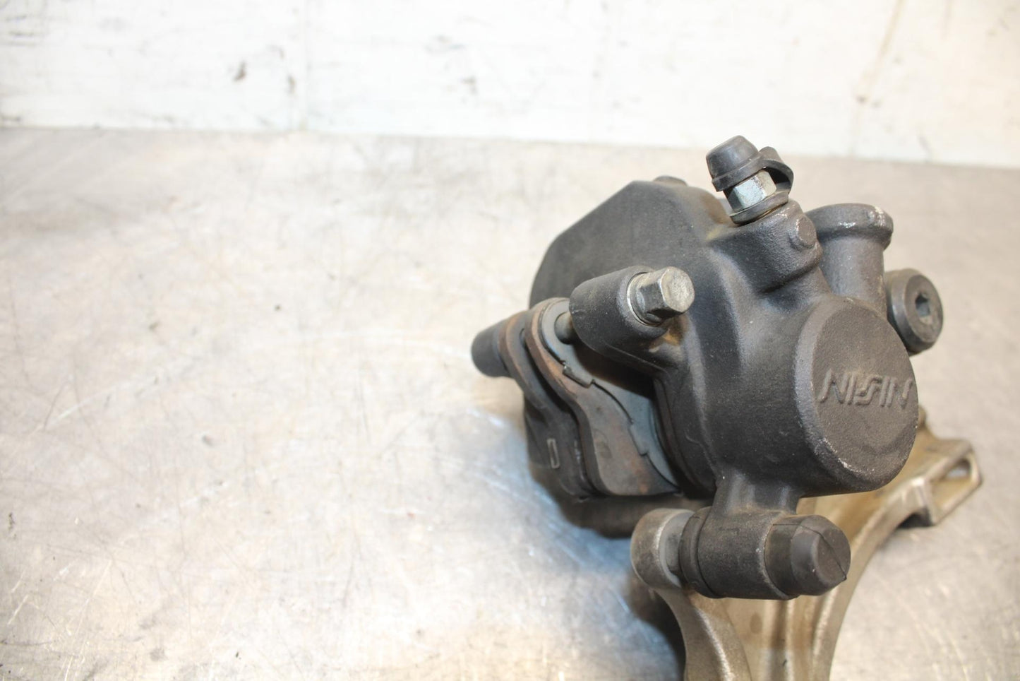 2007 Honda CBR600RR REAR BACK BRAKE CALIPER W MOUNT BRACKET 43150-MFJ-D01 BB42