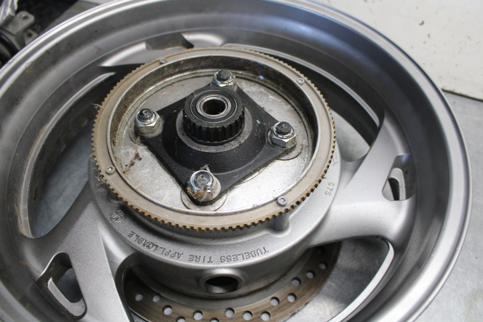 04-12 HONDA ST1300A REAR WHEEL AND ROTOR BACK BRAKE DISC (ITEM B) BB669