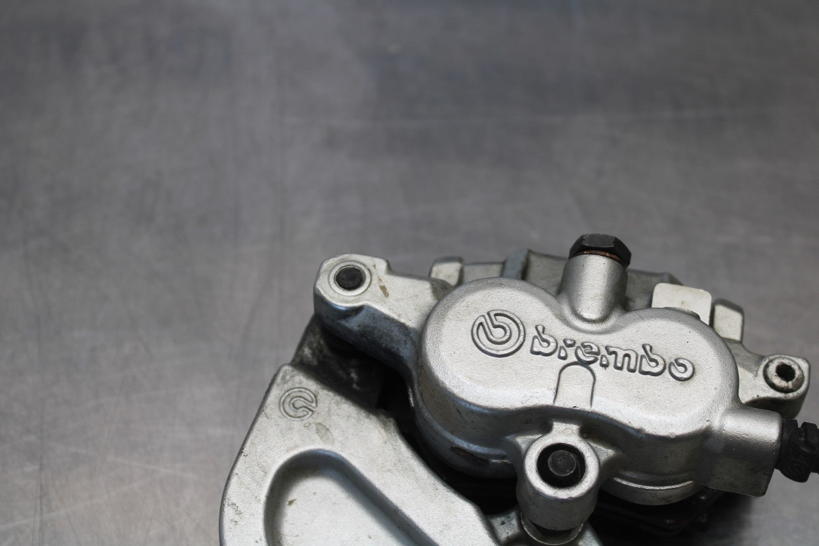 05-06 VICTORY KINGPIN DELUXE REAR BACK BRAKE CALIPER W MOUNT BRACKET BB195