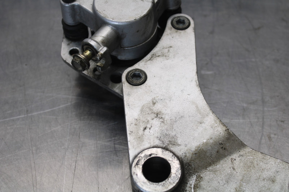 03-08 KAWASAKI VULCAN 1600 REAR BACK BRAKE CALIPER W MOUNT BRACKET BB196
