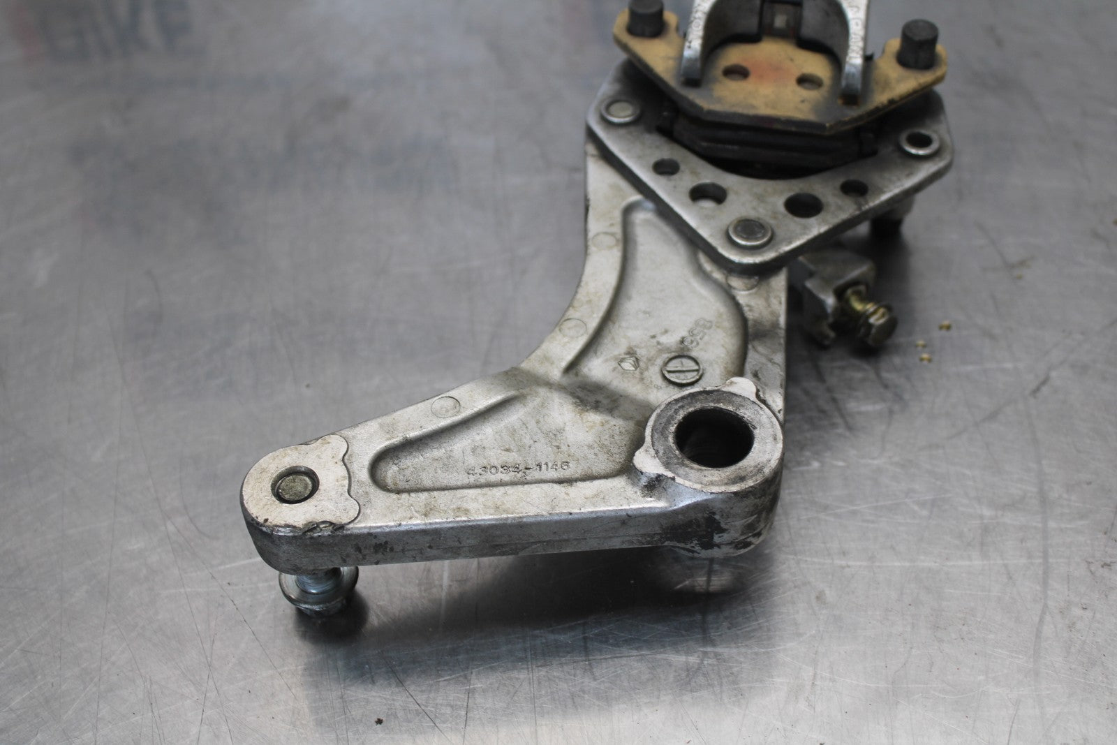 03-08 KAWASAKI VULCAN 1600 REAR BACK BRAKE CALIPER W MOUNT BRACKET BB196