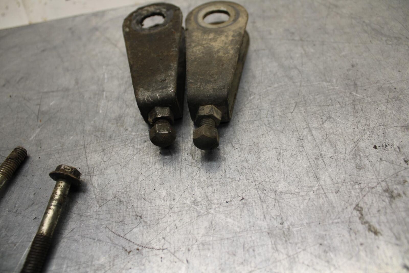 75 SUZUKI GT 550 SWINGARM CHAIN TENSIONER ADJUSTMENT BRACKETS  BB72