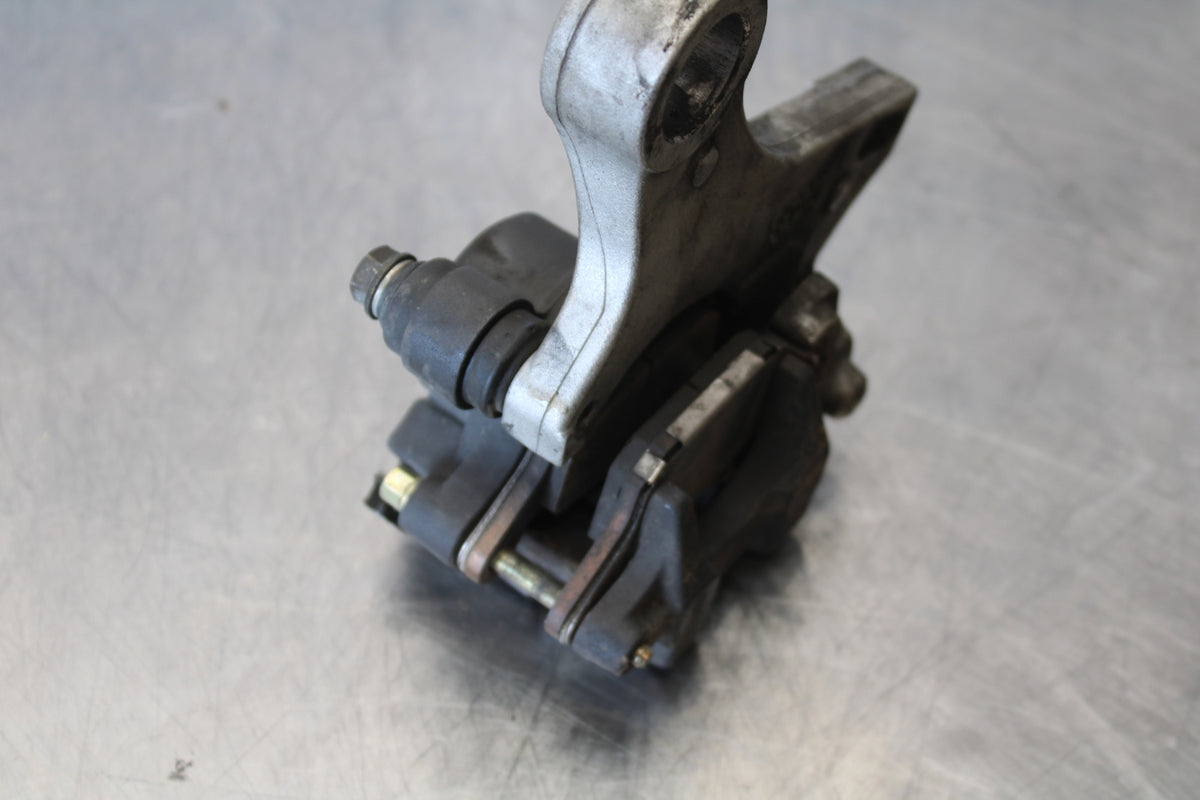 05-06 HONDA CBR600RR REAR BACK BRAKE CALIPER W MOUNT BRACKET BB159