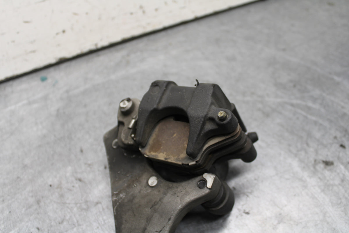 04-06 YAMAHA YZF R1 REAR BACK BRAKE CALIPER W MOUNT BRACKET BB659