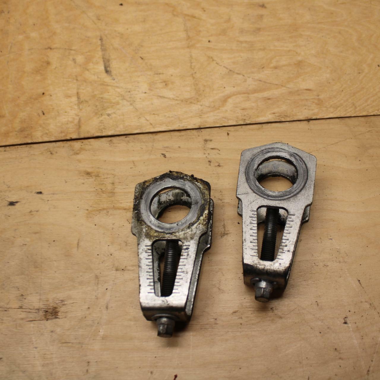 08-14 DUCATI MONSTER 696 SWINGARM CHAIN TENSIONER ADJUSTMENT BRACKETS  BB324