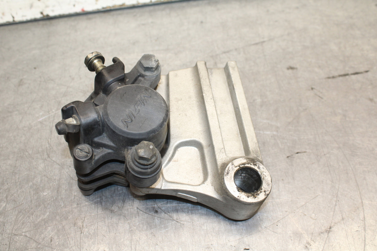 03-04 TRIUMPH DAYTONA 600 REAR BACK BRAKE CALIPER W MOUNT BRACKET BB745