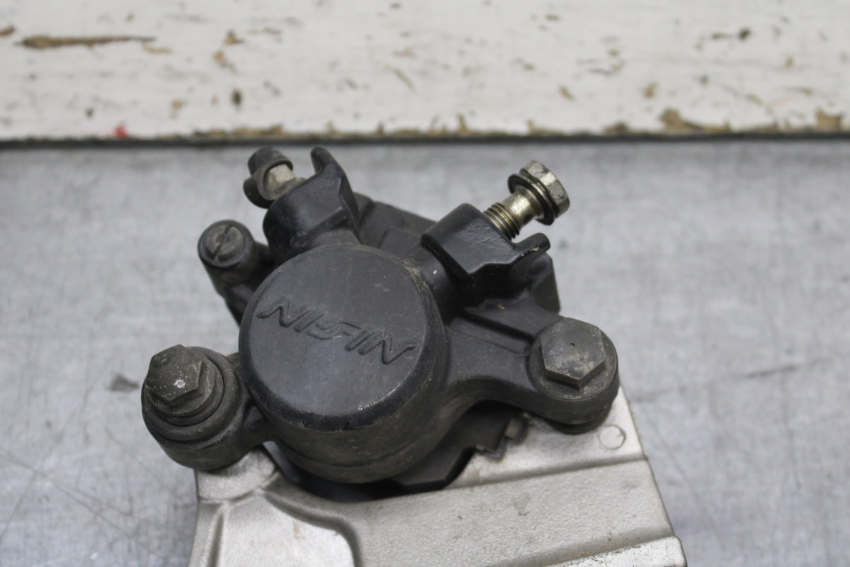 03-04 TRIUMPH DAYTONA 600 REAR BACK BRAKE CALIPER W MOUNT BRACKET BB745