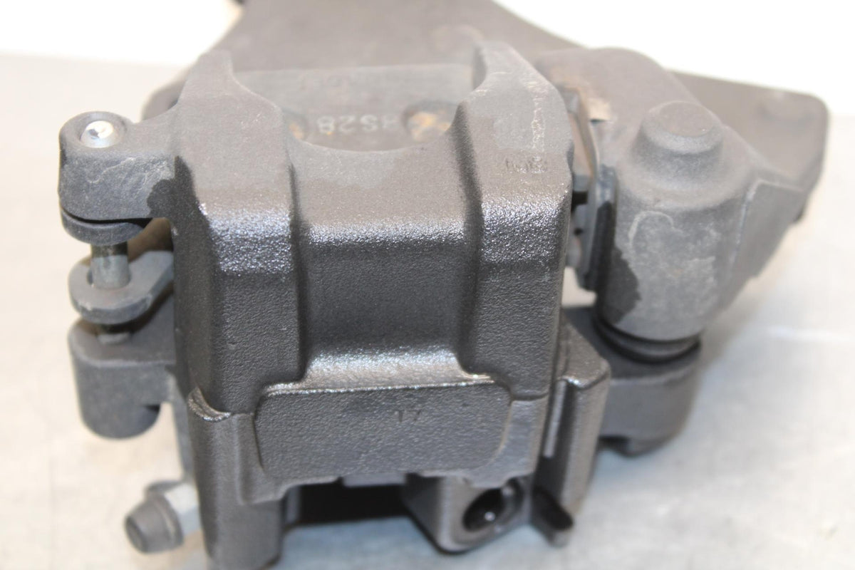 2009 Triumph Daytona 675 REAR BACK BRAKE CALIPER W MOUNT BRACKET BB584