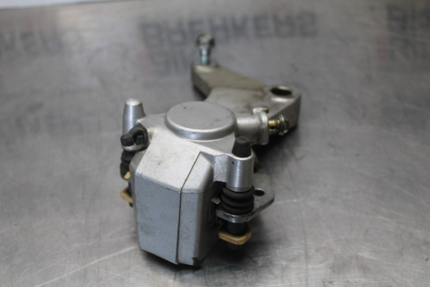 03-08 KAWASAKI VULCAN 1600 REAR BACK BRAKE CALIPER W MOUNT BRACKET BB196