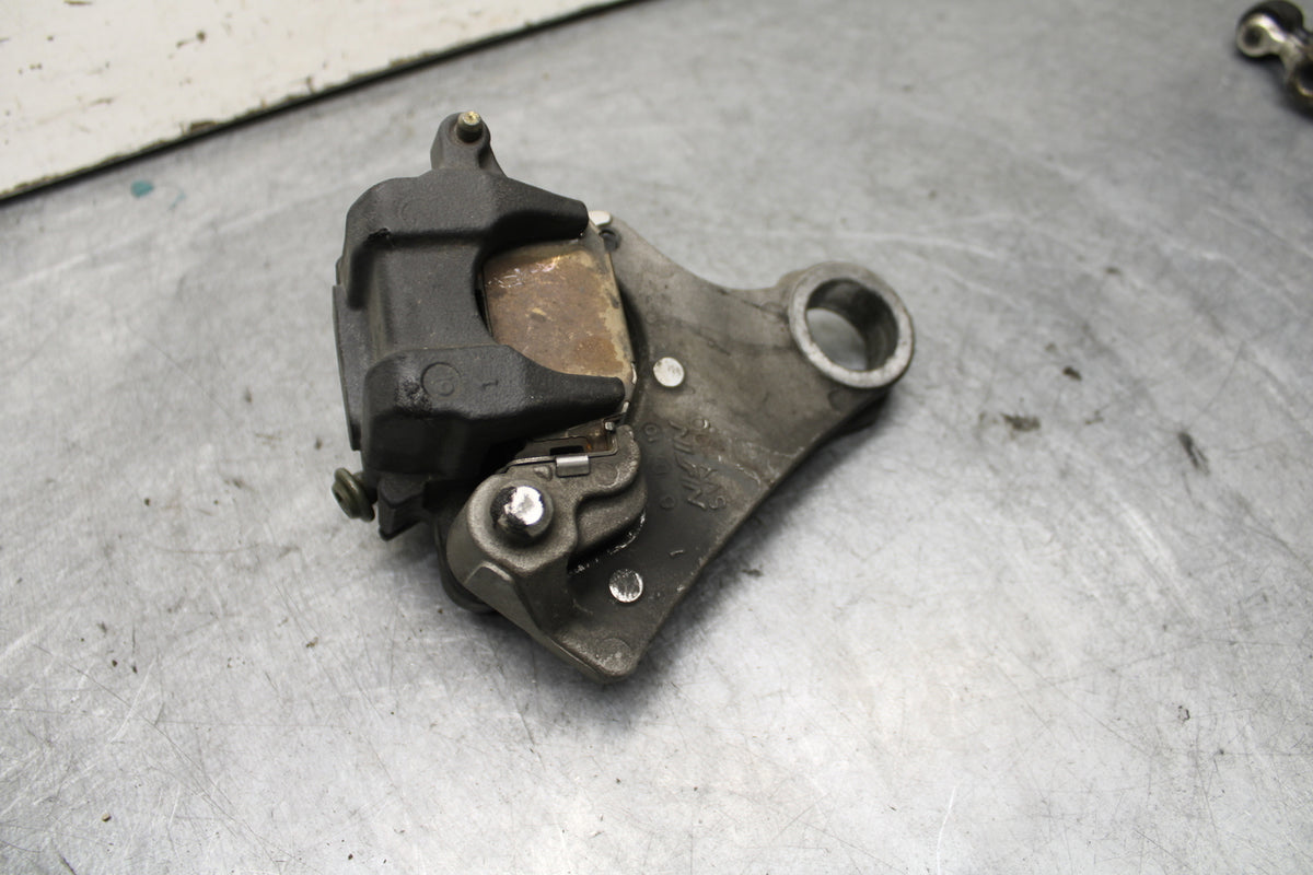 04-06 YAMAHA YZF R1 REAR BACK BRAKE CALIPER W MOUNT BRACKET BB659