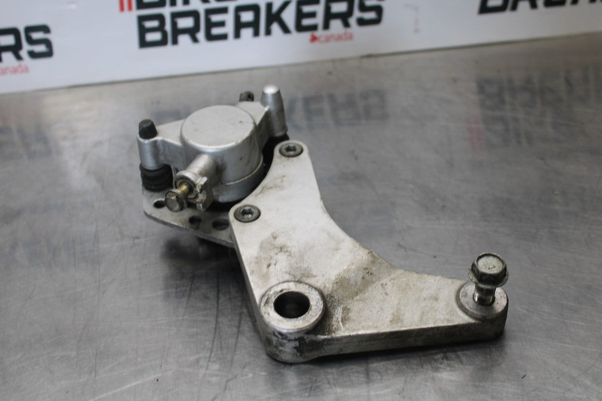 03-08 KAWASAKI VULCAN 1600 REAR BACK BRAKE CALIPER W MOUNT BRACKET BB196