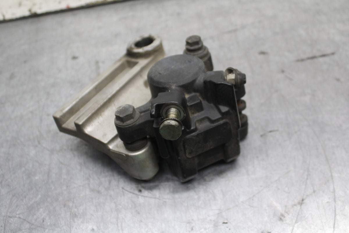 03-04 TRIUMPH DAYTONA 600 REAR BACK BRAKE CALIPER W MOUNT BRACKET BB745