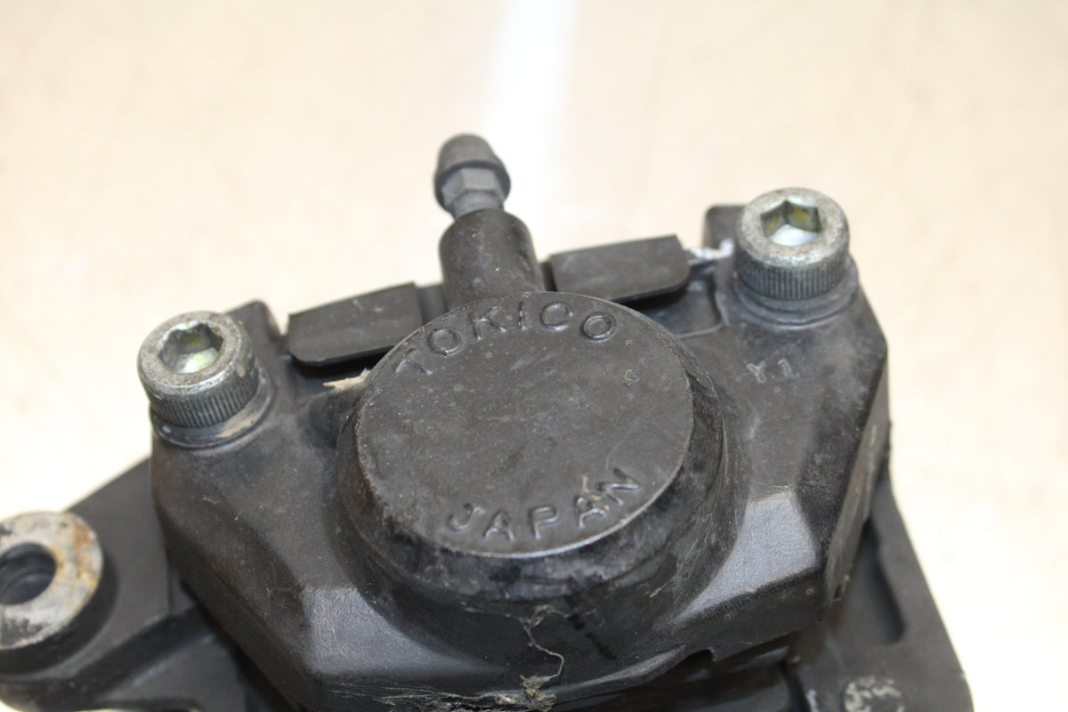 86 SUZUKI GS750ES REAR BACK BRAKE CALIPER W MOUNT BRACKET BB140